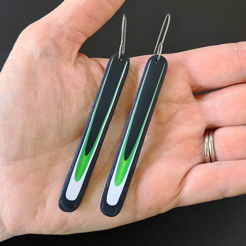 handmade-long-flow-earrings-black-green-white-6 Handmade long dangle earrings with a clean, modern pattern in black, lime green and white. Hand crafted titanium earwires.